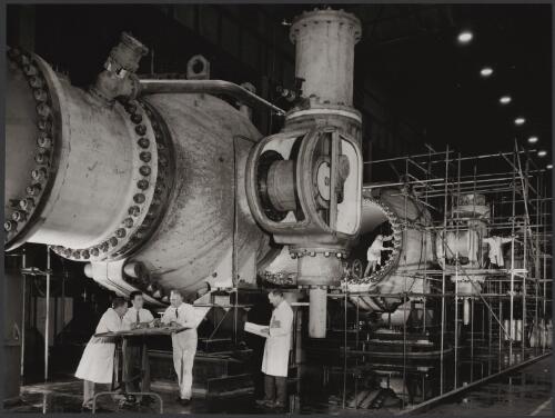 Hitashi valves from Snowy Mountains Hydroelectric Scheme with engineers and Japanese supervisor, Vickers Ruwolt, Burnley, Victoria, 1967 [picture] / Wolfgang Sievers