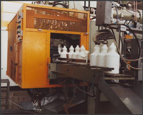 Plastic bottles on the production line at Australian Consolidated Industries Plastic Packaging, Moorabbin, Victoria, 1980, 2 [picture] / Wolfgang Sievers