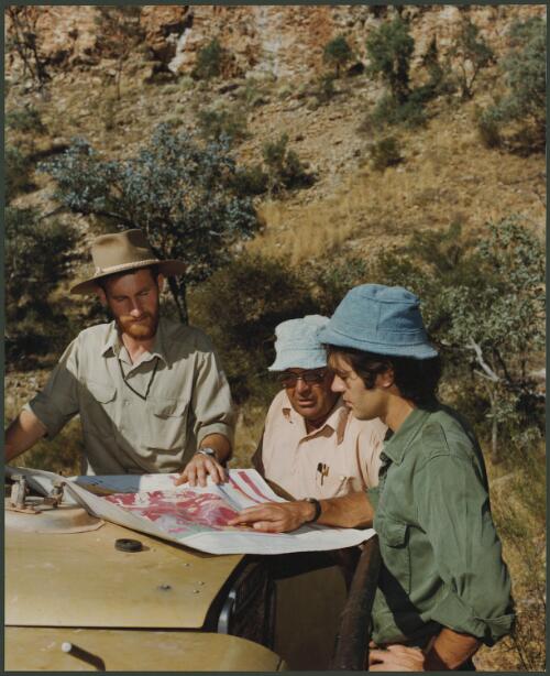 Shell's geological exploration team checking survey maps in the Mount Isa region, Queensland, 1979, 1 [picture] / Wolfgang Sievers