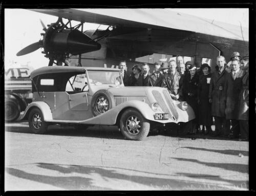 Crowd at an airport gathered around Charles Kingsford Smith's specially designed new car, the Southern Cross, New South Wales, 6 June 1933 [picture]