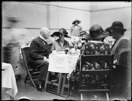 Sir Edgar Bertram Mackennal and wife Lady Annabella Bertram Mackennal sitting at a table with others, New South Wales, ca. 1926, 1 [picture]
