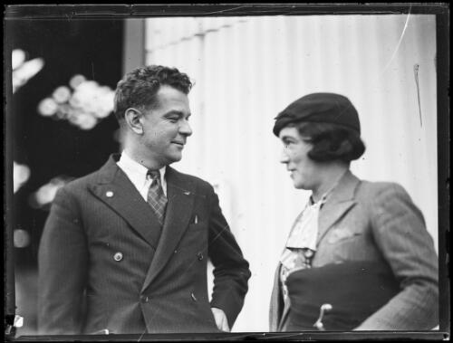 Charles Ulm with a woman before his departure to New Zealand, New South Wales, 12 April 1934 [picture]