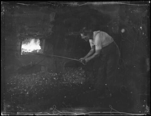 Man working with an open kiln, Bellbird, Sydney, ca. 1930s, 2 [picture]