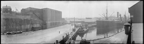 Panorama of a ship belonging to the Japanese company Osaka Shosen moored beside warehouses at Pyrmont, Sydney, ca. 1930s [picture] / EB Studios