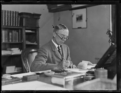 Sir Philip Game writing at his desk in his office, Sydney, ca. 1930s [picture]