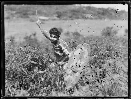 Aboriginal man with body painting holding a spear and a shield, La Perouse, New South Wales, 3 January 1933 [picture]