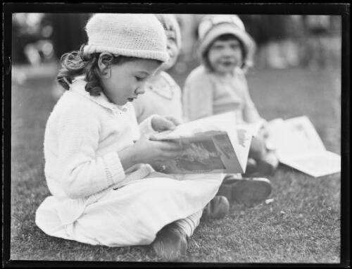 Editor Constance Robertson's daughters reading in garden, Sydney, 1 July 1932 [picture]