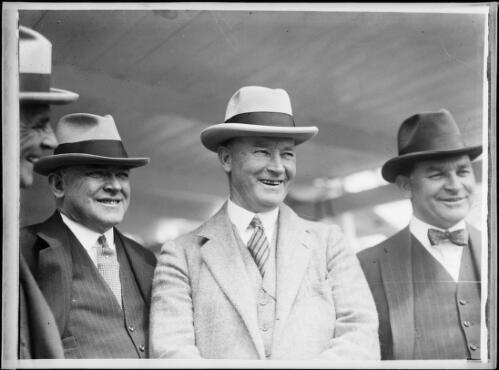 Mr J. Tait of J.C. Williamson's company standing with two other men, New South Wales, ca. 1930 [picture]