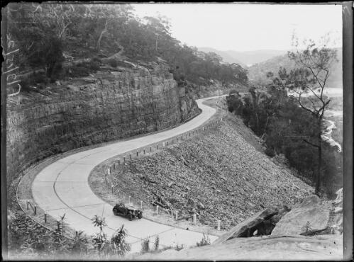 Car driving along the new Pacific Highway, New South Wales, ca. 1930, 1 [picture] / Herbert H. Fishwick