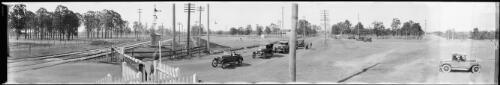 Panorama of cars queued at a railway crossing, Warwick Farm, New South Wales [picture] / EB Studios