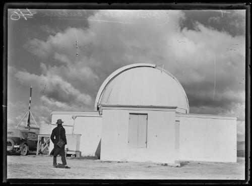 Man standing outside the Mount Stromlo Observatory, Canberra, ca. 1925 [picture]