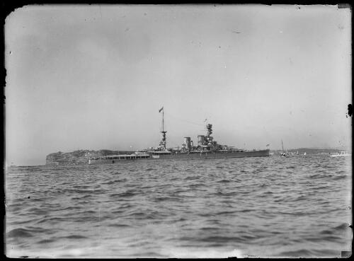 HMS Renown, flying a Royal Pennant and carrying the Duke and Duchess of York on their royal visit, entering Sydney Harbour with Inner South Head in the background, Sydney, 1927, 1 [picture]