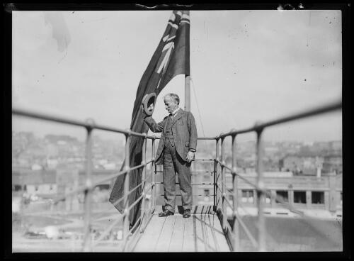 Engineer John Bradfield tipping his hat from a walkway on the newly constructed Sydney Harbour Bridge, Sydney, ca. 1932 [picture]