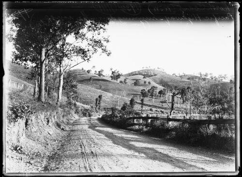 Pacific Highway running down the range to Gloucester, New South Wales, 1934 [picture] / Herbert H. Fishwick