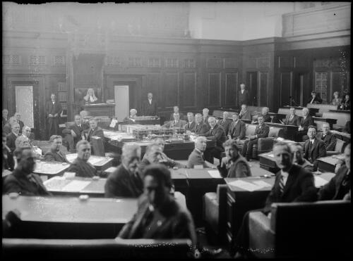 Politicians sitting in a chamber for the opening of Parliament House, Sydney, ca. 1920s [picture]
