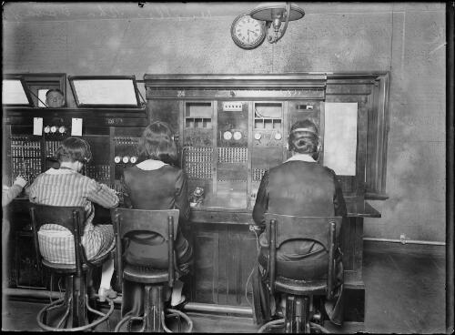 Three wireless telephone operators at a switchboard, Sydney, ca. 1930 [picture]