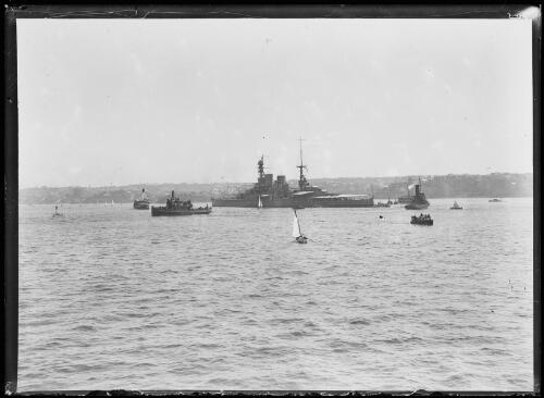 H.M.A.S Australia surrounded by smaller boats and sail craft, New South Wales, 1924 [picture]