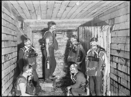 Six Bellbird Colliery miners wearing proto air filters, Bellbird, New South Wales, 9 September 1909 [picture]
