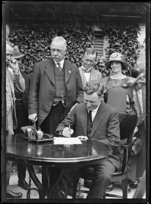 Acting Prime Minister Earle Page signing the first official document at the first official cabinet meeting in Canberra, 30 January,1924 [picture]