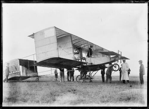 Ground crew preparing escape artist Harry Houdini's Voisin Biplane, Diggers Rest, Victoria, March 1910 [picture]