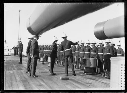 Commanders inspecting officers lined up onboard the H.M.S. Repulse of the British Fleet, Sydney, 1924 [picture]