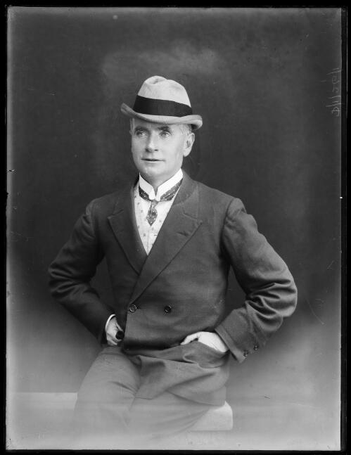 Herald photographer Mr George Bell  wearing a hat, New South Wales, ca.1920 [picture] / Herbert H. Fishwick