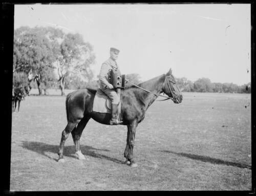Mr George Bell a photographer for the Sydney Morning Herald seated on a horse with a camera, New South Wales, 1910 [picture]