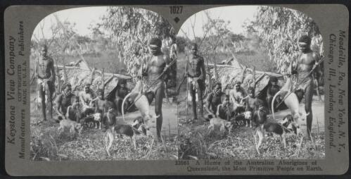 Aboriginal Australians in front of their shelter with one man holding a kangaroo, Queensland, approximately 1915