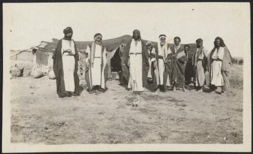 Group of Bedouin men standing in front of a tent, Gaza Strip, approximately 1917