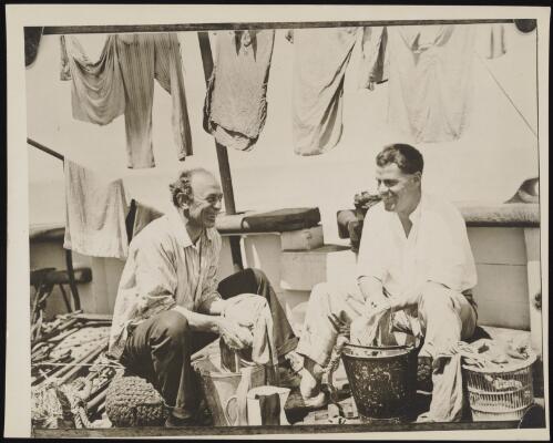 Frank Hurley and James Marr on board the ship Discovery, approximately 1930