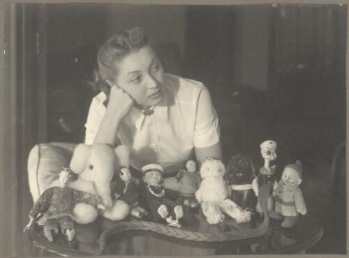 Domestic study of Irina Baronova with her collection of stuffed animals and dolls, Ballets Russes, ca. 1930s [picture]