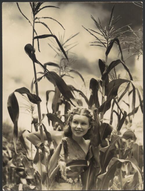 Outdoor photograph of Moya Beaver in costume for The reed pipes of pan, 1935, [2] [picture]