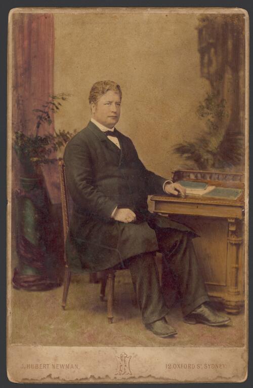 [Portrait of Edmund Barton as a mature man, seated at a writing desk] [picture] / J. Hubert Newman