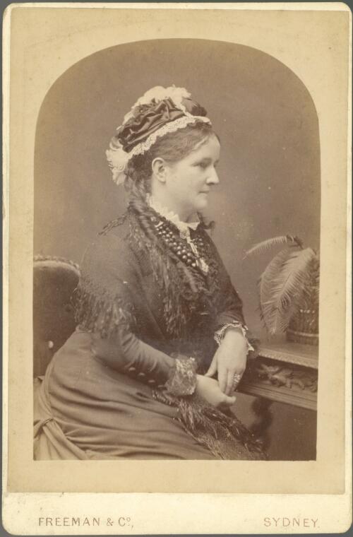 [Portrait of a woman seated, facing to the right] [picture] / Freeman & Co