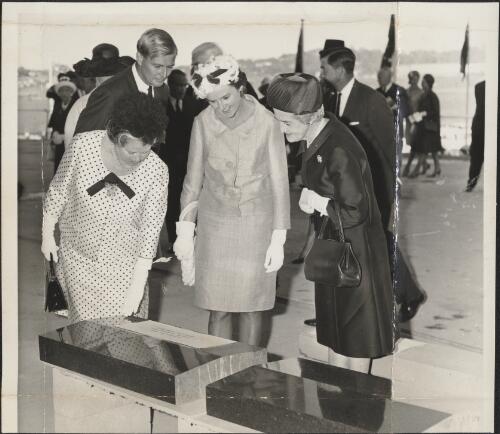 Minister of the Interior Doug Anthony, Margot Anthony, Zara Holt and Dame Pattie Menzies looking at samples of polished granite handrailing that will surround the podium of the National Library of Australia, at the foundation stone laying ceremony, Canberra, 31 March 1966 / J. Crowther, Australian News and Information Bureau