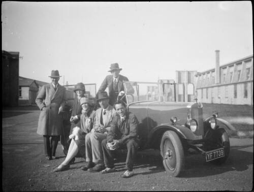 Stella C.T. and Norah Daly with four men in front of a car, England, 1924 / Michael Terry