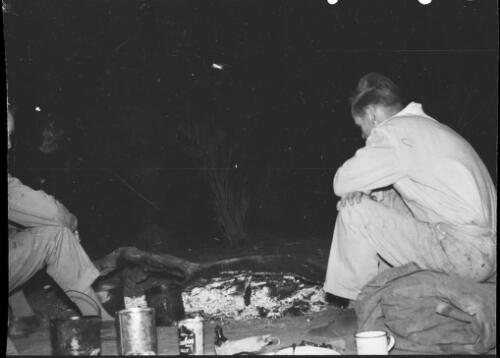 Michael Terry and another man sitting around a campfire, Hermannsburg area, Northern Territory, 1961 / Michael Terry