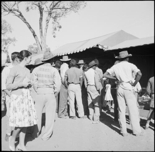 Crowds gathered in front of the sideshow amusements at the Alice Springs Show, Northern Territory, May 1961 / Michael Terry