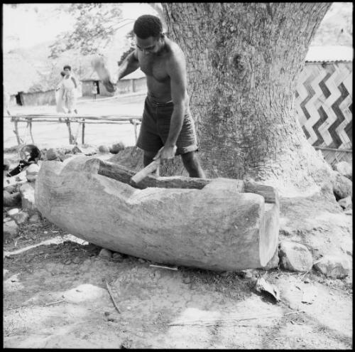 Man playing a lali drum, Fiji, 1966 / Michael Terry