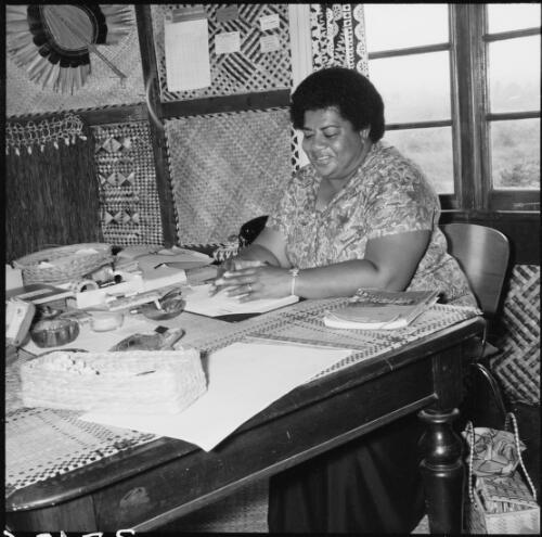 Fijian woman sitting at a table in a souvenir shop, Fiji, November 1969 / Michael Terry