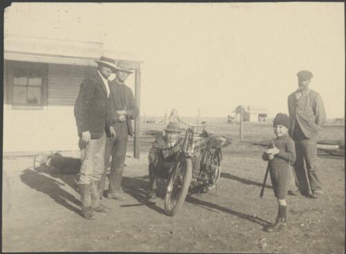 Four men and a young boy near a motorcycle, South Australia, 1914 / Alexander Lorimer Kennedy