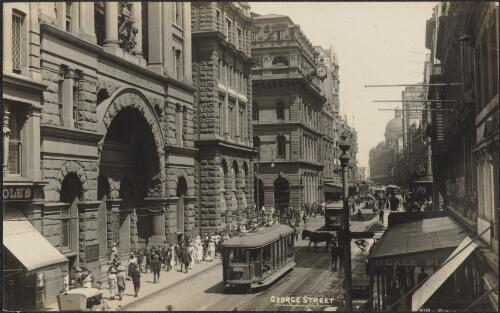 City buildings and trams along George Street, Sydney, approximately 1920