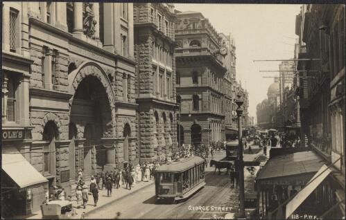 City buildings and trams along George Street, Sydney, approximately 1920