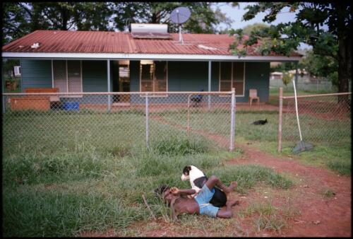 An Aboriginal boy and his dog, Ramingining, Arnhem Land, Northern Territory, 2013 / Matthew Abbott