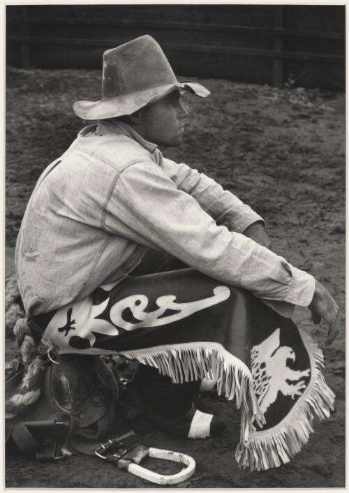 Rodeo rider in decorative chaps sitting on a saddle, Wanaaring, 1996 / Jeff Carter