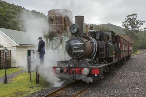 West Coast Wilderness Railway train driver Tony Rinaudo standing next to Mount Lyell No. 3 Abt class steam locomotive at Lynchford Station, Tasmania, 10 August 2019 / Greg Power