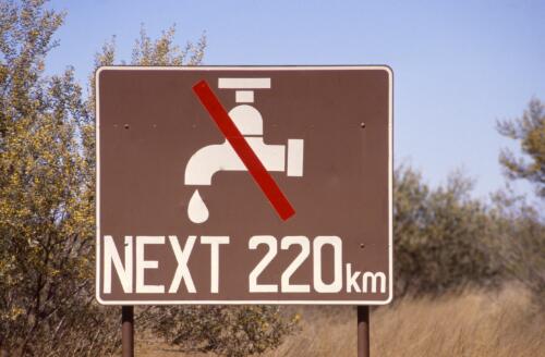 Water warning sign, Uluru-Kata Tjuta National Park, Northern Territory, approximately 1968 / Robin Smith