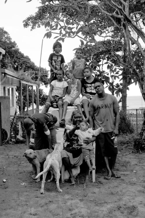 A group of Aboriginal Australians with two dogs, Palm Island, Queensland, 21 November 2010 / Hamish Cairns