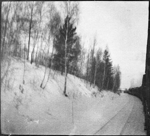Journey northward bound train passing snow covered hill, Russia, approximately 1917 / Michael Terry