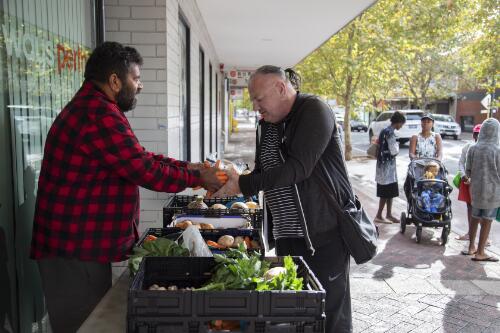 A volunteer from the Salvation Army providing food for the community during the COVID-19 pandemic, Northbridge, Western Australia, 17 April 2020 / Philip Gostelow